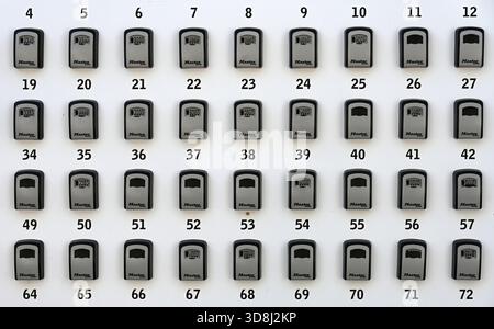 Lines or Rows of Numbered Key Boxes, Lock Boxes or Security Boxes Stock Photo