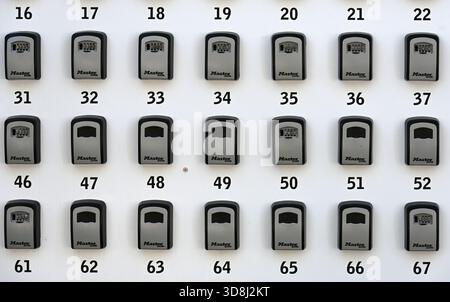 Lines or Rows of Numbered Key Boxes, Lock Boxes or Security Boxes Stock Photo