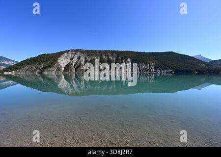 Panorama or Panoramic View of Mirror Image Reflections on Perfectly Still or Tranquil Lake Castillon in the Verdon Gorge Regional Park Provence France Stock Photo