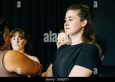 Women group discussing, listening, collaborating in a workshop Stock Photo