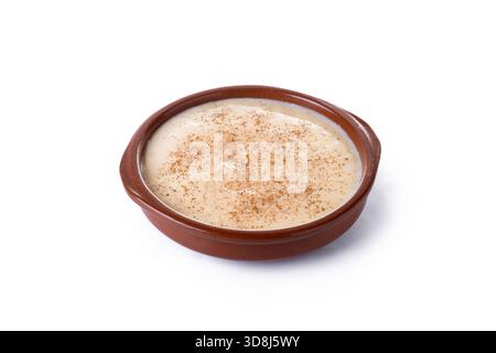 Creamy homemade Spanish custard served in a bowl with cinnamon isolated on white background Stock Photo