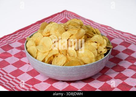Potato chips in bowl Stock Photo