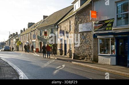People looking in shop windows walking along a street in Hay-on-Wye during the Hay Winter Festival Wales UK November 2025 Great Britain KATHY DEWITT Stock Photo