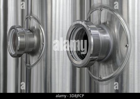 Cylindrical stainless steel water tanks, close-up shot, abstract background Stock Photo