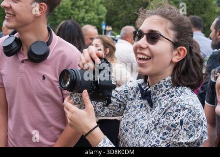 Female photographer in action. Stock Photo
