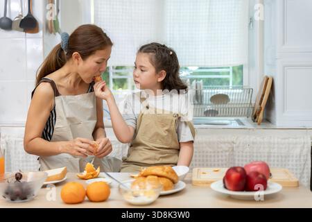 family time, breakfast, activities together during the holidays. Parents and children are having a meal together during the holidays. New home for fam Stock Photo