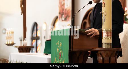 Speaker At Church Altar Delivering Message During Religious Wedding Ceremony Stock Photo