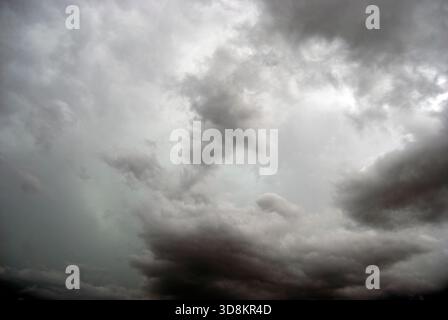 Stormy clouds. Dark grey sky background. Heavy dark clouds before the storm. Grey sky texture. Hurricane Stock Photo