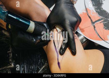 Tattooer during a tattoo artist session