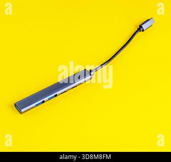 This USB-C hub provides multiple ports for connecting various devices, perfect for modern laptops and tablets Stock Photo