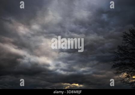 Dramatic storm clouds fill the sky with a sense of foreboding Stock Photo