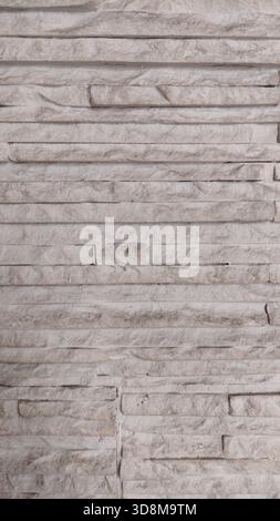 High-resolution white stone wall texture with layered pattern. Perfect for architectural backgrounds, design mockups, and construction material refere Stock Photo