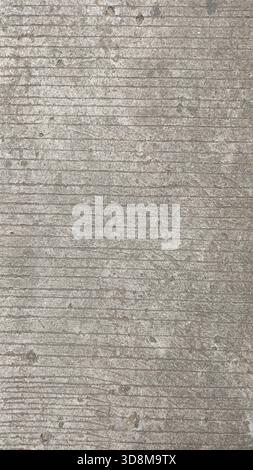 High-resolution rough concrete floor texture with visible grooves and natural imperfections. Ideal for backgrounds, construction materials, and design Stock Photo