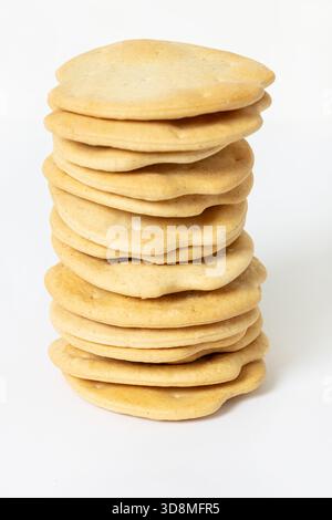 Pile of Ship biscuits isolated on white background Stock Photo