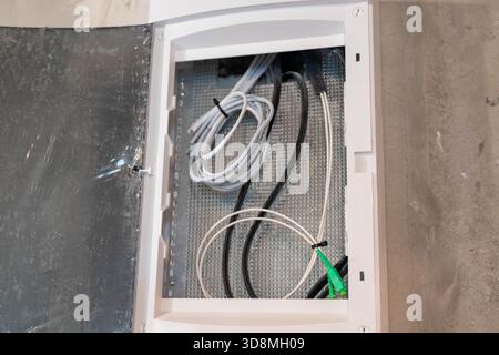Udaipur, India - June 09 2025: AVVNL digital electricity meter by HPL with 000018 kWh reading and labeled wiring, mounted for power usage monitoring. Stock Photo