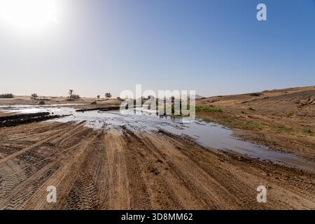 The rain water left on the ground in the Sahara Desert after a rare rainfall event in Morocco. Stock Photo