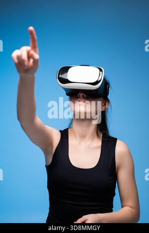 Architect Using VR Interface for 3D Project Interaction and Virtual Design Navigation in Futuristic Space Stock Photo