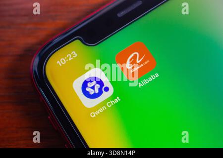 Quito, ECUADOR - Dec 1 2025 : Smartphone screen showing Qwen Chat AI assistant and Alibaba icons. Concept of Chinese AI and technology. Stock Photo