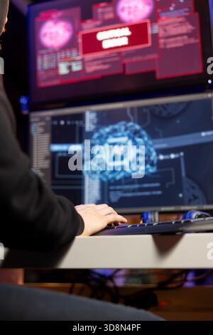 Close up of cybercriminal seeing critical error popup on PC display when trying to break into company servers. Rogue software developer seeing failure alert message when coding virus using AI Stock Photo