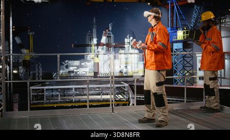 Male engineer using virtual reality equipment to inspect offshore drilling rig, applying advanced visualization for oil platform operations, maintenance and manufacturing systems. Stock Photo