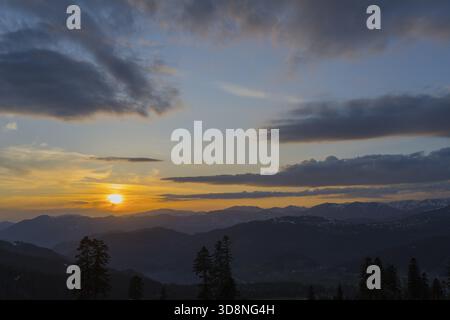 A romantic sunset over mountains with colorful sky and clouds, view from Goderdzi Pass, Ajara region, Adjara, autonomous republic, Georgia Stock Photo