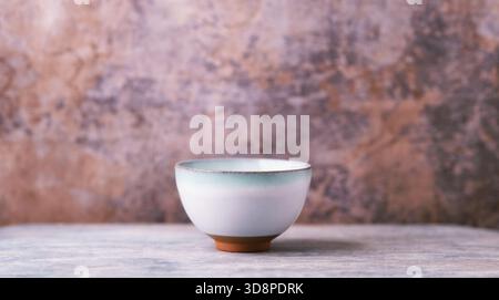 Traditional, handcrafted ceramic on wooden background. Soft focus. Copy space. Stock Photo
