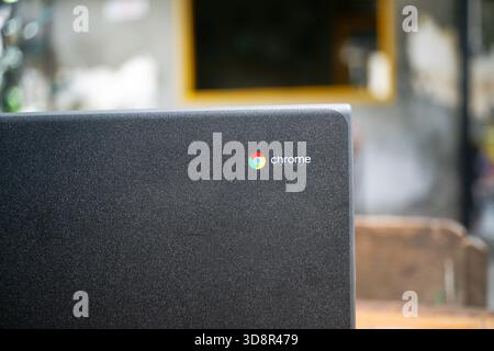 close up of google chrome logo on chromebook cover laptop Stock Photo