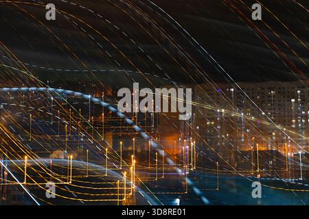 Abstract long exposure photo of night city with colorful light trails and blurred buildings creating dynamic urban motion and futuristic energy backgr Stock Photo