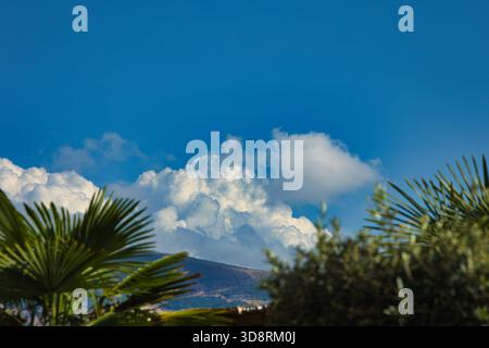 Summer holiday in the mountains, fluffy fairytale clouds over the mountains in Vlore, Albania - August 23, 2025 Stock Photo