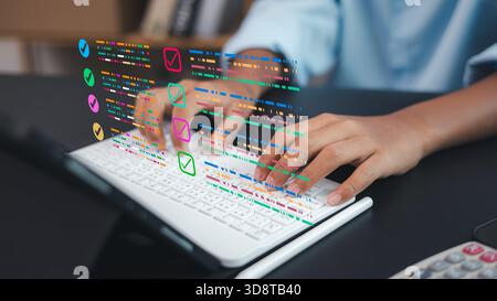 Female hands typing on laptop with digital checklist interface, business technology, productivity workflow, task management and online data organizati Stock Photo