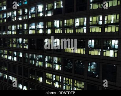 Night Windows of a High-Rise Ofiice Block in China Stock Photo