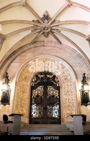 View of the ornate entrance door at Hamburger Rathaus in Hamburg in Germany on June 18 2025. The door is adorned with intricate ironwork and is flanke Stock Photo