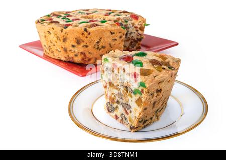 A homemade traditional light fruitcake on a white background. Stock Photo
