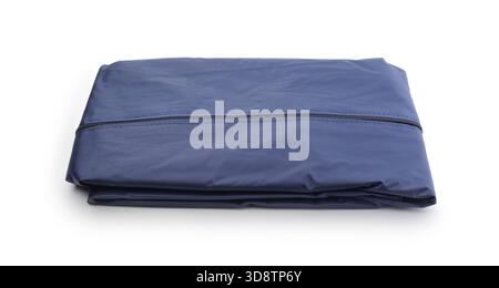 New blue folded nylon  raincoat isolated on white. Stock Photo