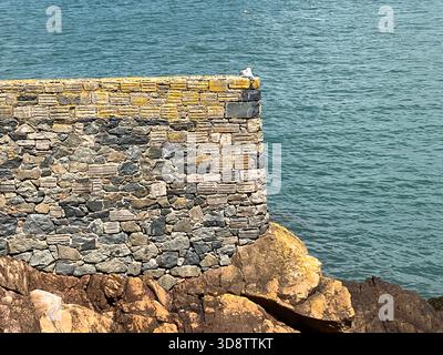 British Channel Isles. Guernsey. St Peter Port.  View of old sea wall section. Stock Photo