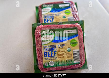 Roseland, USA - April 27, 2025: Ground beef grass fed raw in cooked meat by Aldi simply nature brand, organic food in plastic bag package Stock Photo
