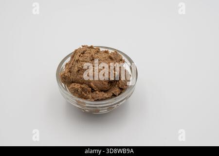 Chicken Liver Pâté Served in Glass Bowl on White Background – Homemade Savory Spread for Appetizers and Snacks Stock Photo