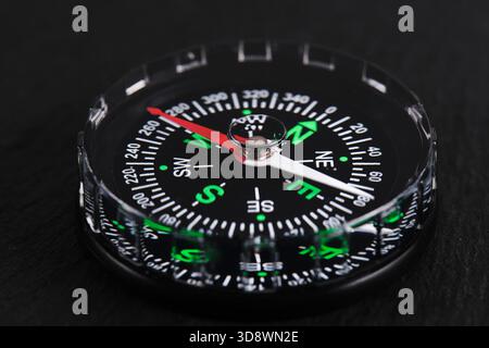 Compass on black background in close up. Concept travel and business Stock Photo