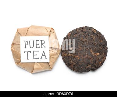 Dry pressed puer tea with sticky note on white background Stock Photo