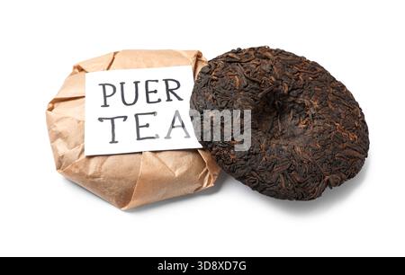 Dry pressed puer tea with sticky note on white background Stock Photo
