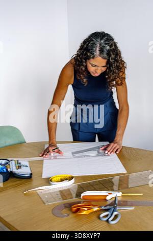 Woman designing fashion patterns for independent business Stock Photo