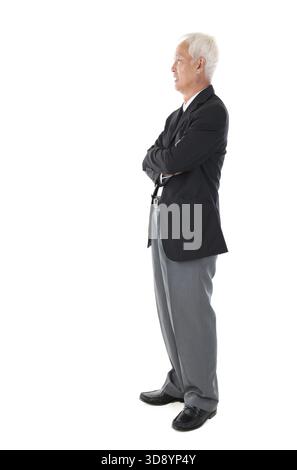 Side view full body Asian senior businessman standing isolated white background Stock Photo