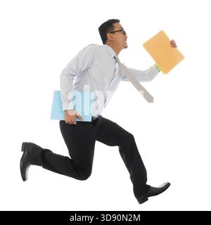 Full body young Asian businessman in hurry running or jumping up with some file and documents in his hand, isolated on white background Stock Photo