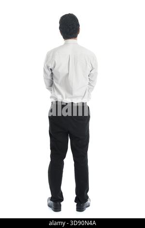 Full body rear view of Asian young male in casual business attire, standing isolated on white background Stock Photo