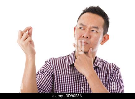 Asian man hand holding blank sign with unsure face expression, isolated over white background Stock Photo