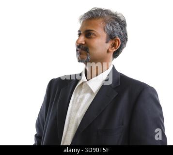 Good looking mature Asian Indian business man with business suit looking at side, isolated on white background. Portrait of handsome Indian male model Stock Photo