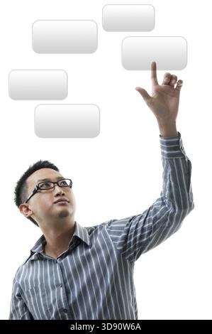 Asian businessman hand pointing on visual screen, standing isolated on white background Stock Photo