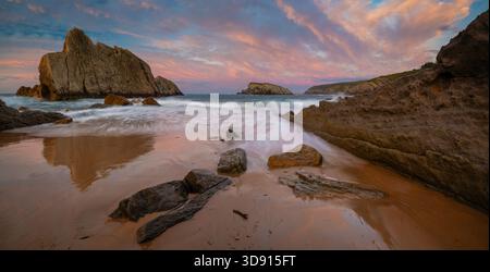 Dramatic Sunset on Spanish Coast Near Santander,Arnía Beach Stock Photo