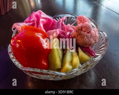 Assorted salad in a transparent glass bowl. Stock Photo