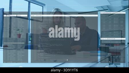 Working pair in blazer and sweater reviewing code on laptop at office table with terminal overlay Stock Photo